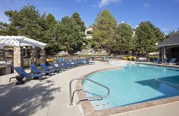 Relaxing resort-style pool with sundeck and spa